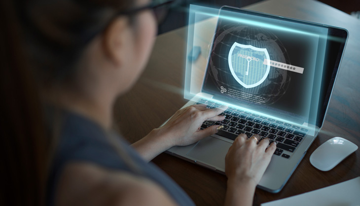 Woman in front of a screen with security icons